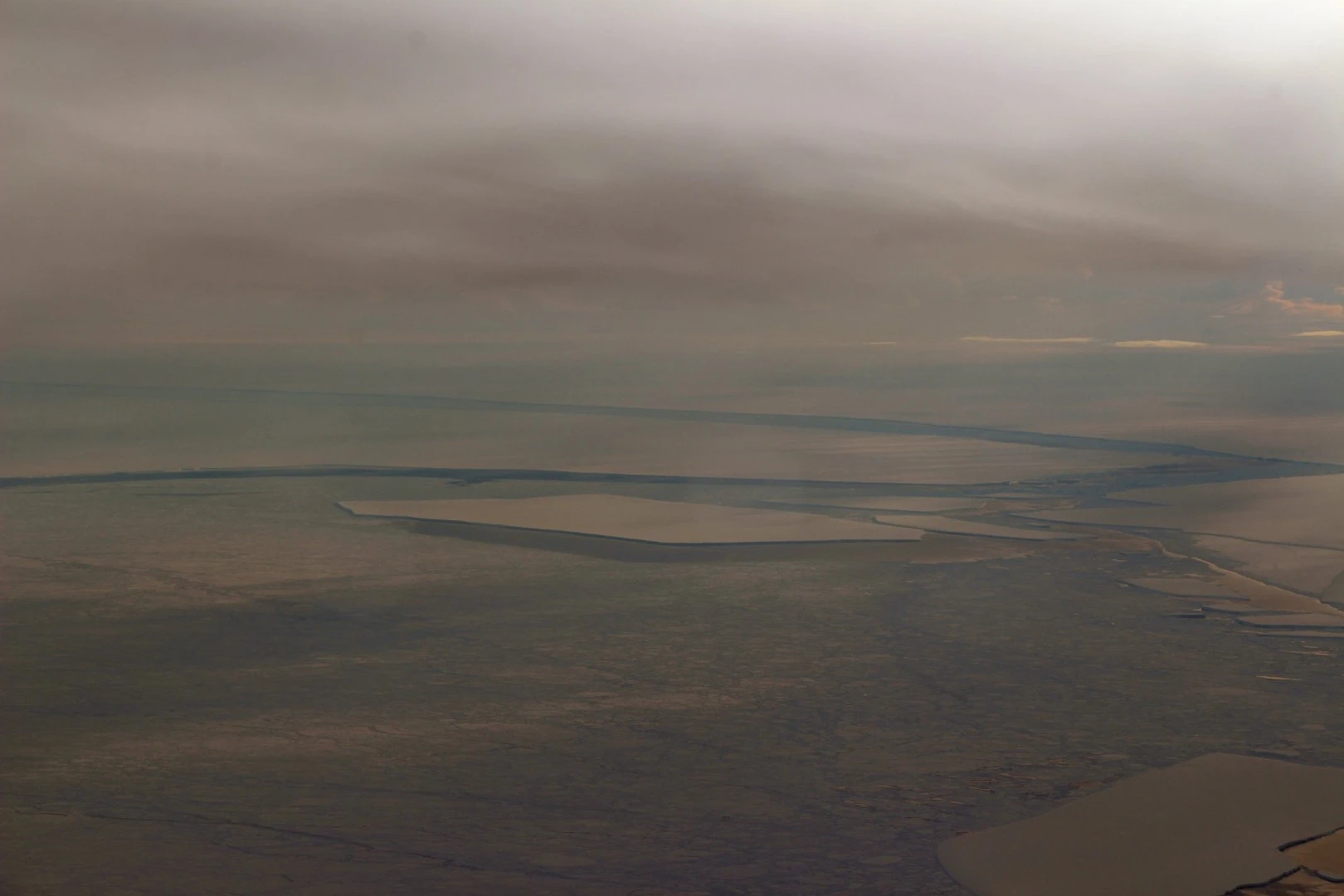 Approaching the iceberg with the Larsen Ice Shelf at the very top of the picture