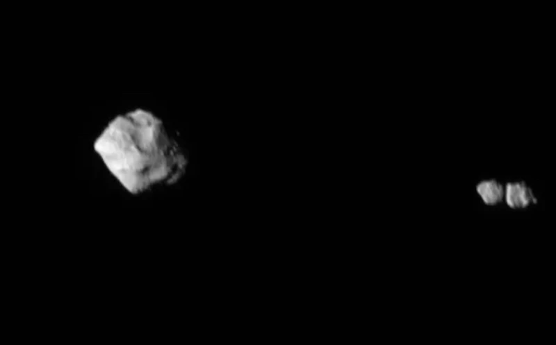 This image, taken by Lucy six minutes after the first, reveals that Dinkinesh's satellite is actually a contact binary – an object made up of two smaller bodies touching – the first seen orbiting an asteroid