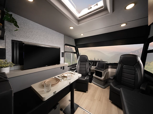 The flexible multi-configuration dining lounge includes an available pop-up TV, turning it into a living room when dinner is over