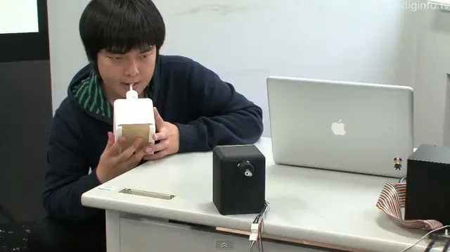 A student at Tokyo's University of Electro-Communications has invented a robotic tongue device for online kissing (Image: DigInfo News)