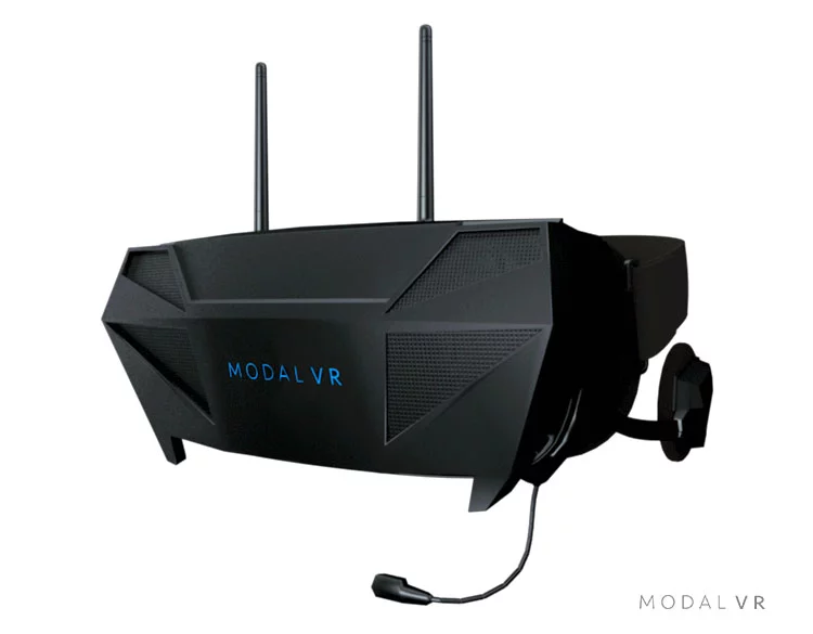 The Modal VR Visor communicates with the system wirelessly, and includes headphones with 3D audio and a microphone