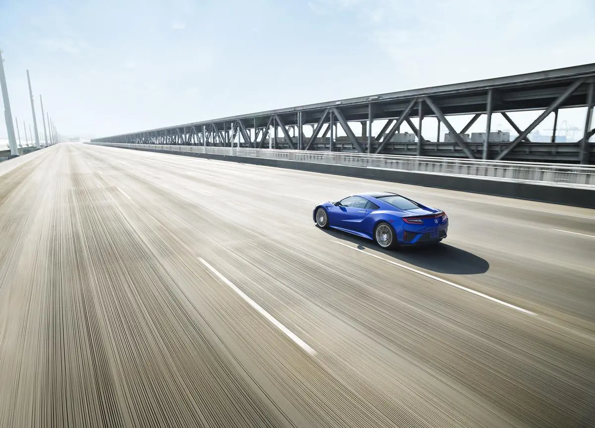 The transmission is coupled to the engine via an electric motor