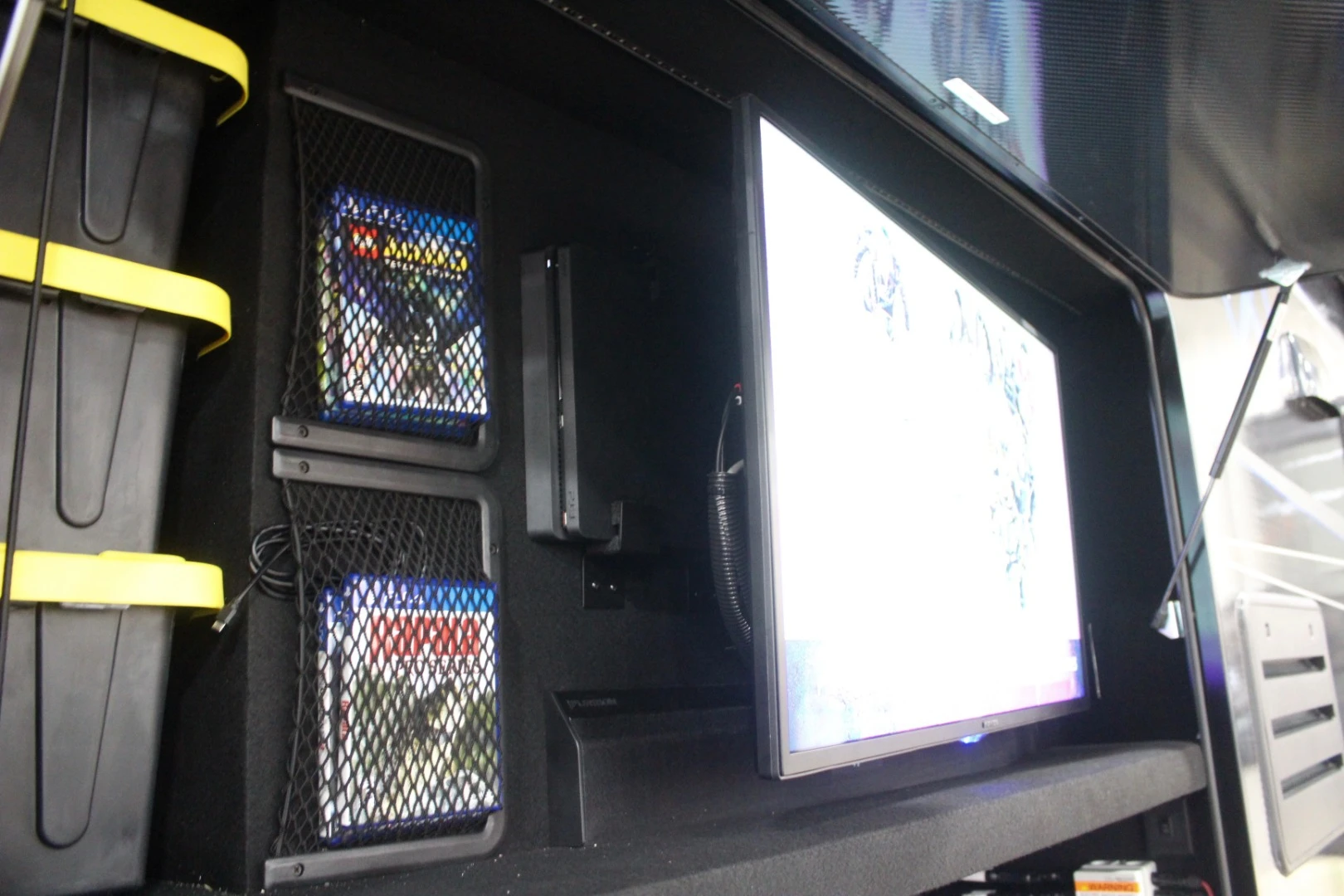 The outdoor entertainment center includes a PlayStation 4 mounted behind the TV