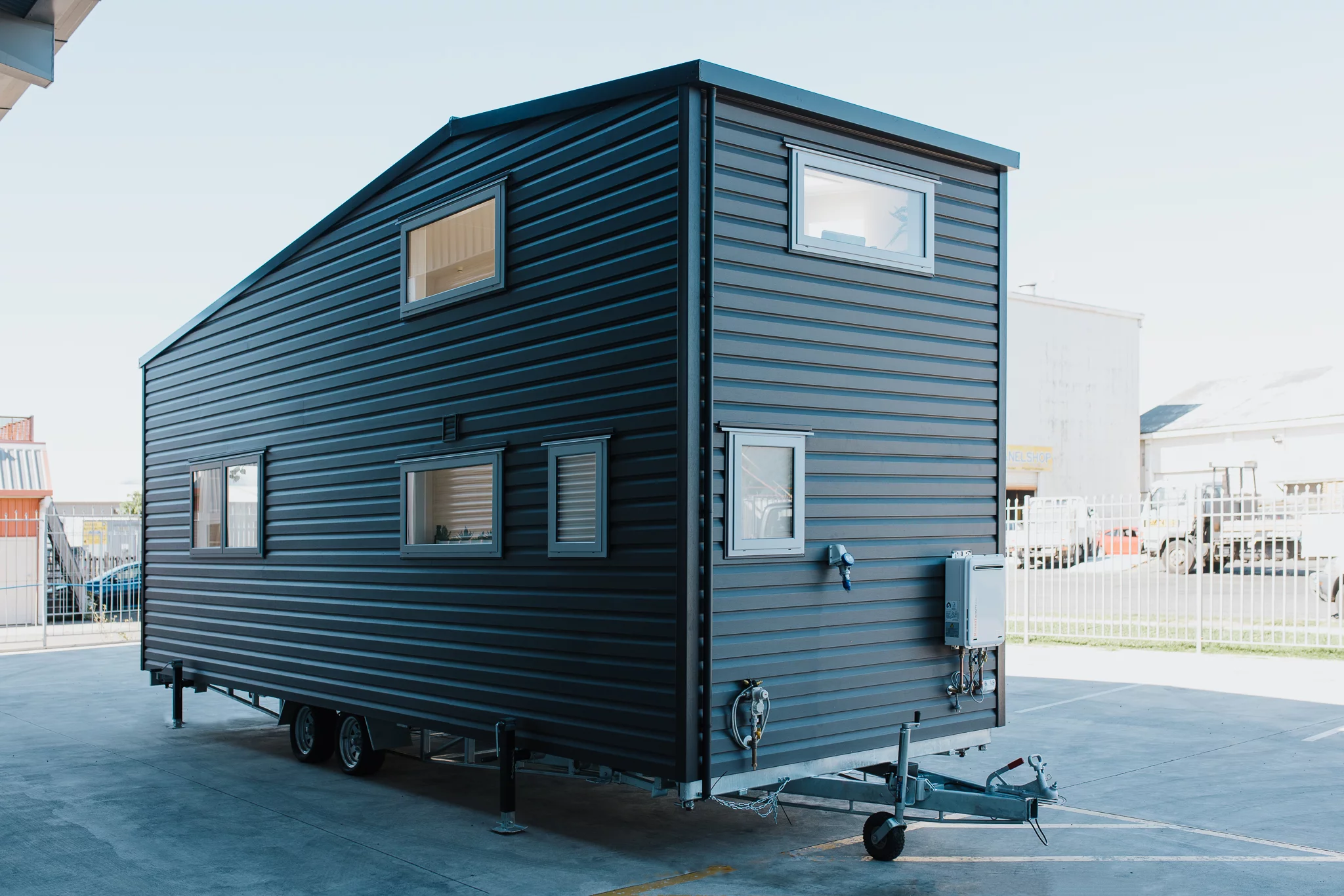The Wai-Iti Tiny House has a vinyl exterior that's similar to previous Build Tiny models