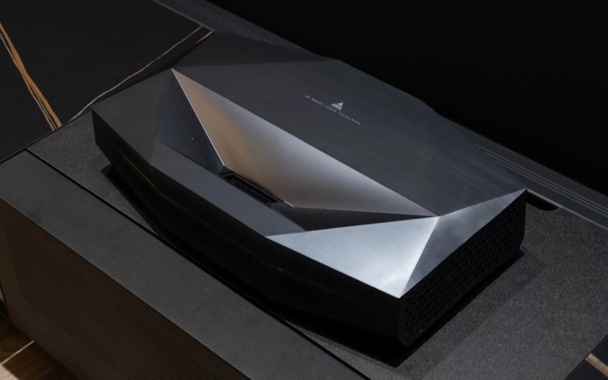 The PixelLock technology combines optical, mechanical and digital elements to compensate for "lens element tolerances, temperature-induced expansion, micro-warping of UST angles, reflective path inconsistencies, and DLP sequencing artifacts." That's said to result in uniformly sharp, color-rich 4K visuals "even at extreme screen sizes up to 200 inches"