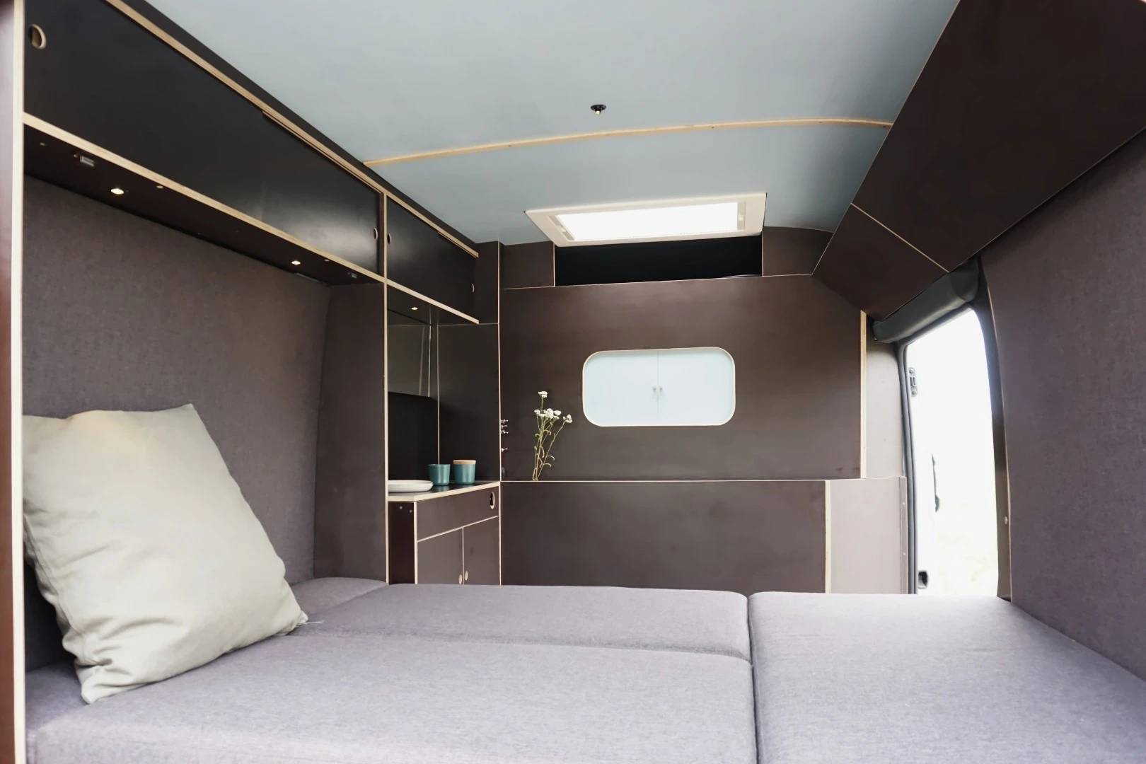 To transform the van into night mode, two Murphy beds fold down to create a comfy sleeping zone for two adults