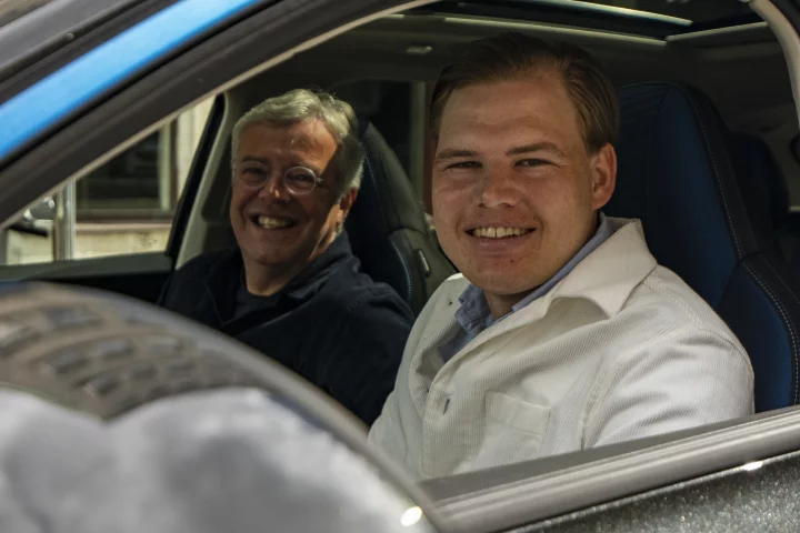 Member Jakob Werner (right) with Lynk & Co CEO Alain Visser (left), and one of the first 01 SUVs