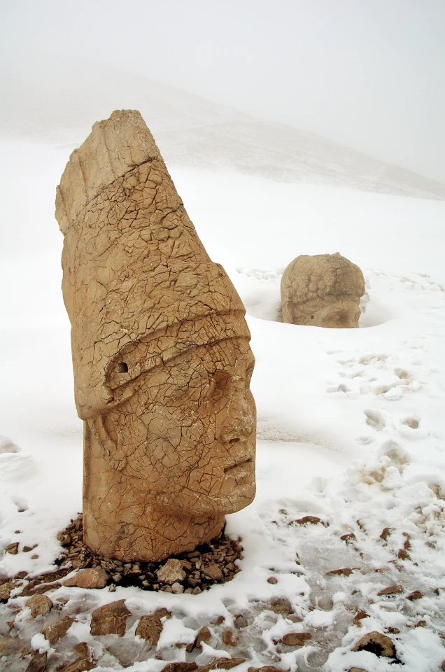 Historic Photographer of the Year. Shortlisted. Kingdom of Kommagene. The top of Mount Nemrut, near Adiyaman province in Turkey. In 62 BC, King Antiochus I Theos of Commagene built on the mountain top a tomb-sanctuary flanked by huge statues 8–9-meter-high (26–30 ft) of himself and statues of some Greek and Iranian gods.
