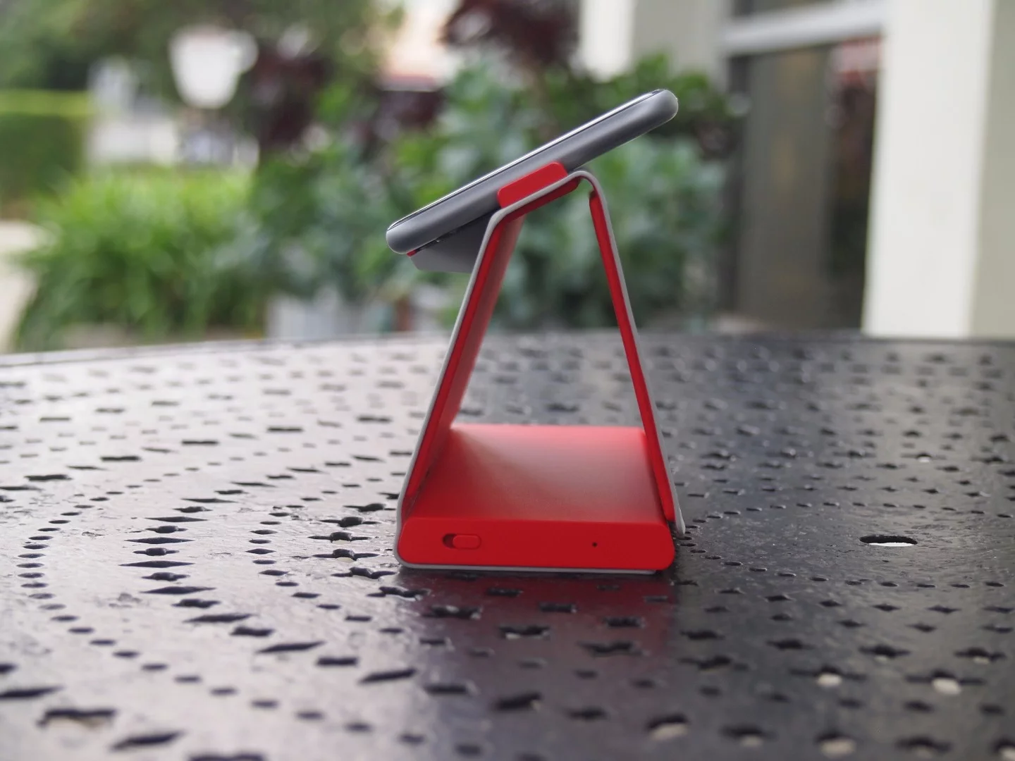 The dock is compact, with the battery built into its base