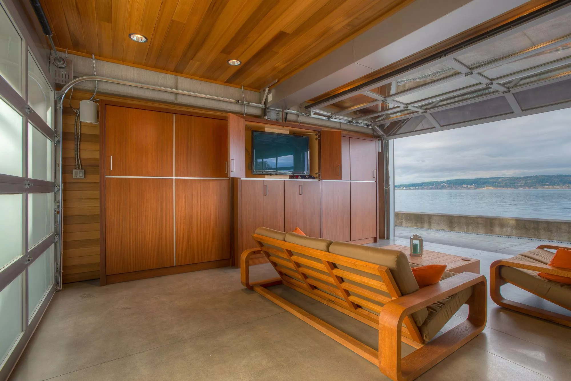 The main living area is on the second floor, accessed via tough bent plate steel stairs(Photo: Lucas Henning)