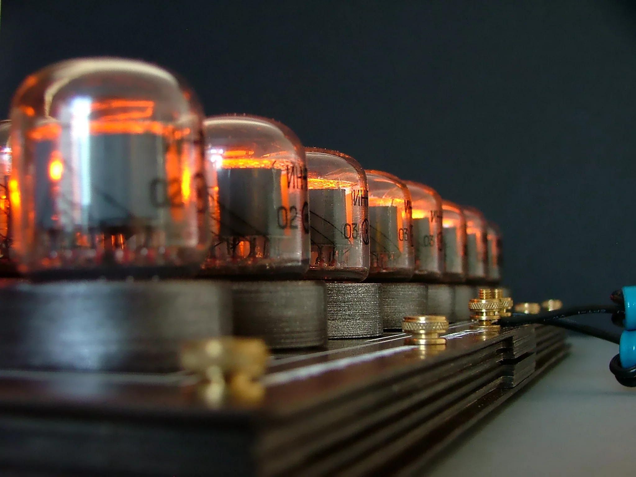 When a Nixie chess piece is placed on the board, the display lights up