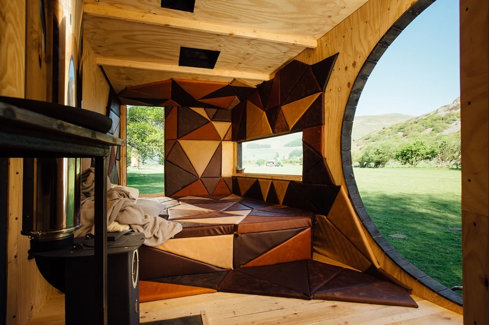 The sleeping quarters are made up of a bespoke leather cushioned bed and padded wall, doubling as a comfy spot to lounge, relax and read a book during the day