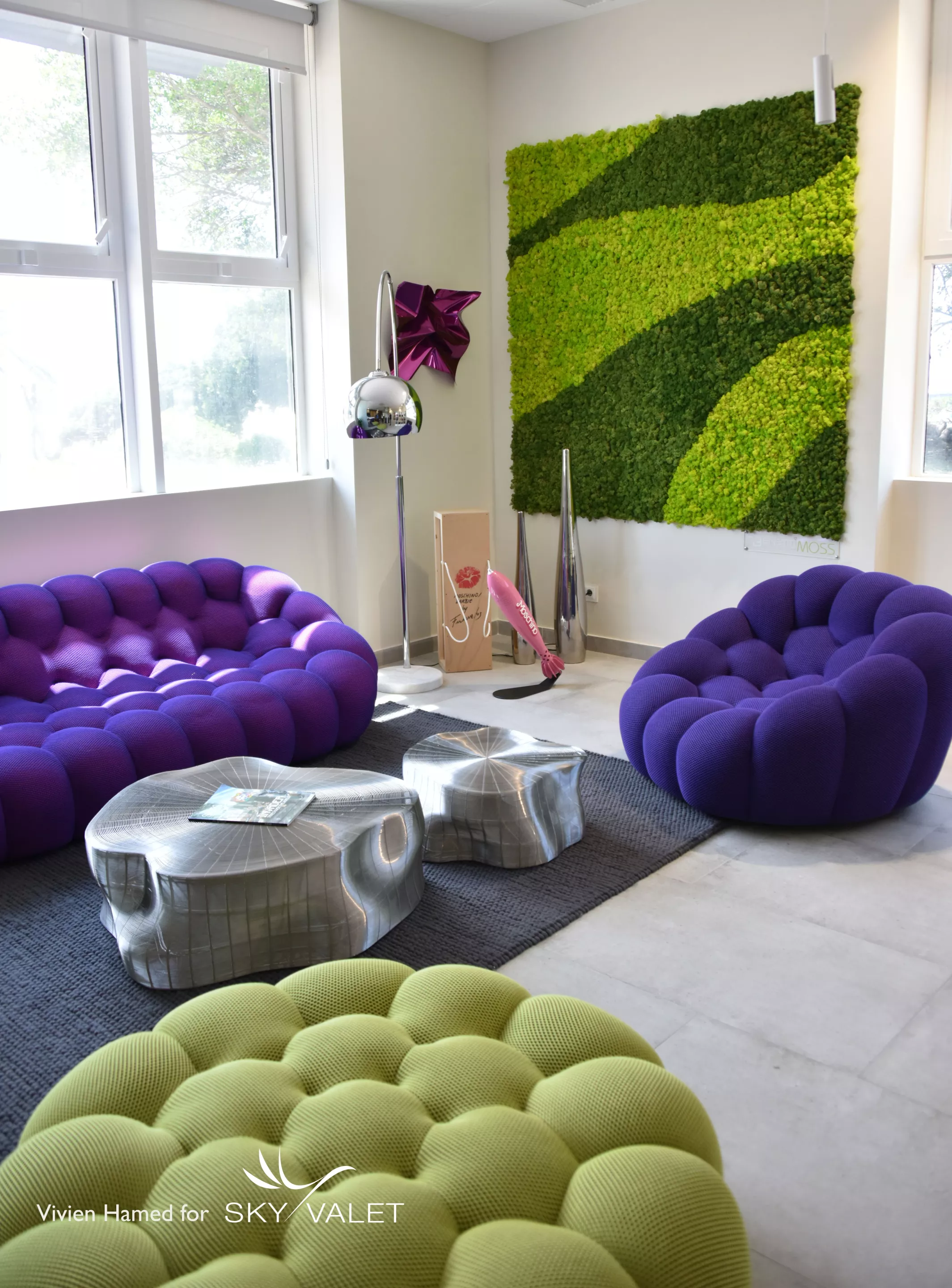 The green walls are made using "Benetti Moss," a 100% natural and stabilized lichen