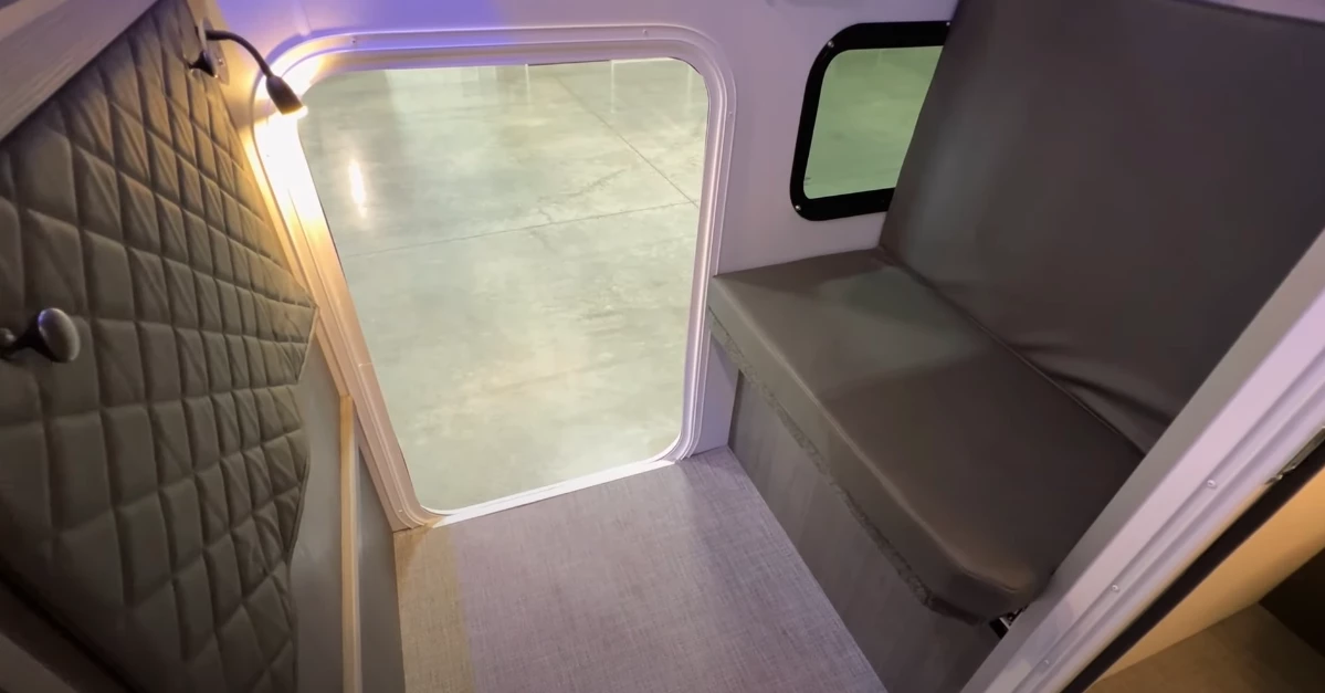 This tall external door allows owners to load in gear and cargo but also looks like a fun entryway into the office/bunkroom