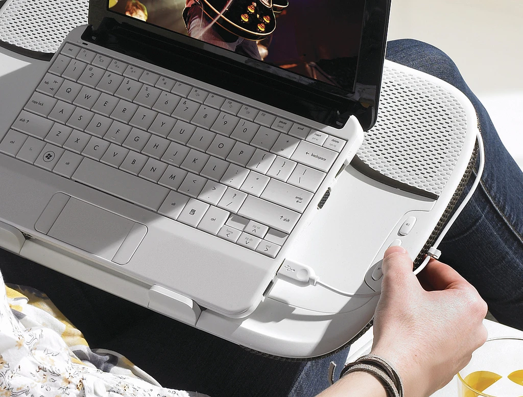 The speakers are positioned outside the laptop for full effect