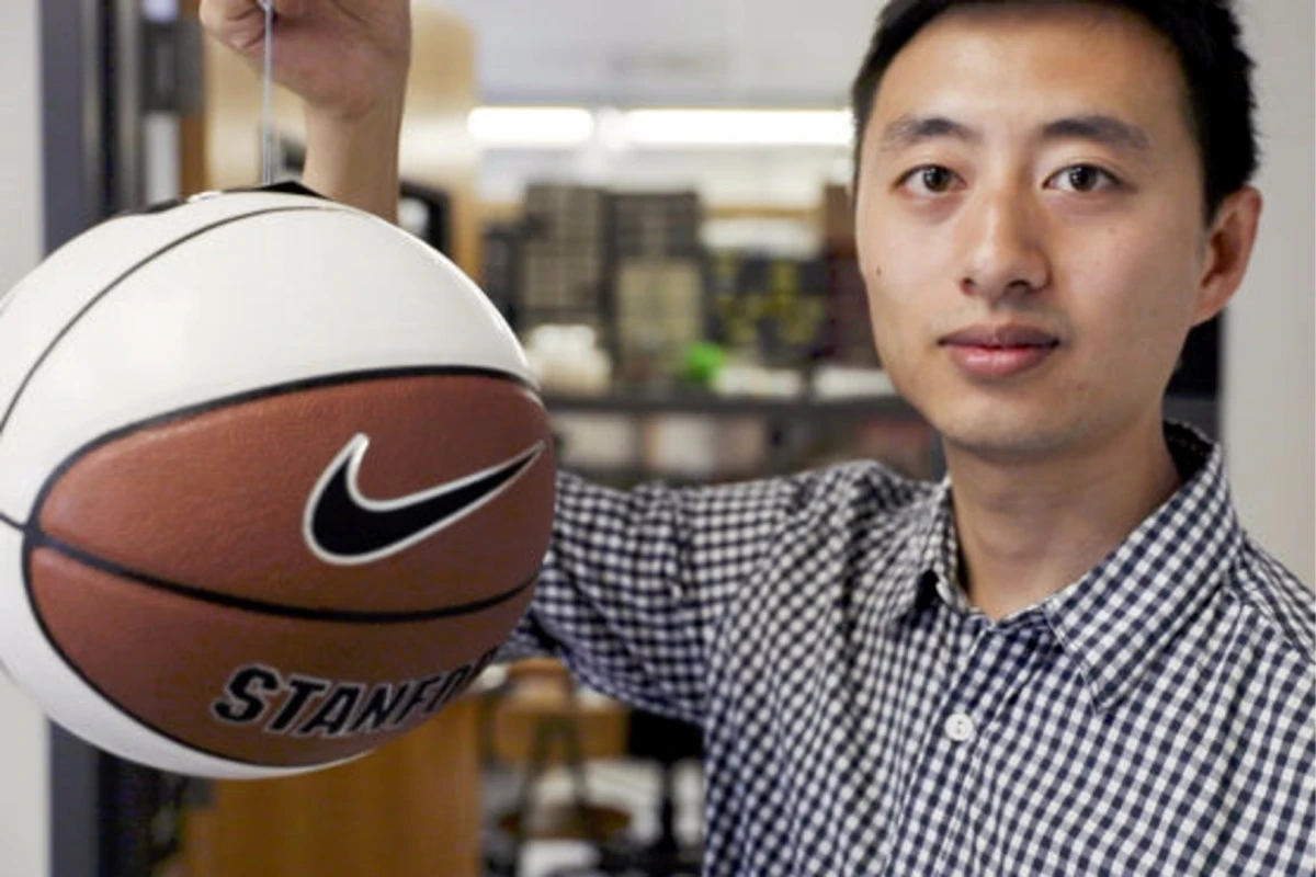 Hao Jiang, graduate student in the Cutkosky lab, shows a basketball being gripped by the gecko-inspired adhesive