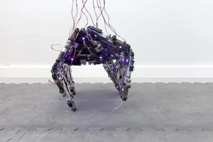 Made of multiple linked triangular modules, a Mori3 robot walks on four legs