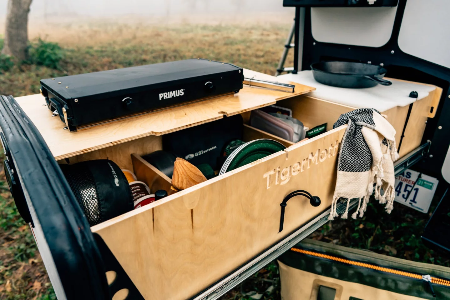 Instead of an inbuilt stove, Taxa furnishes the TigerMoth with a portable camping stove