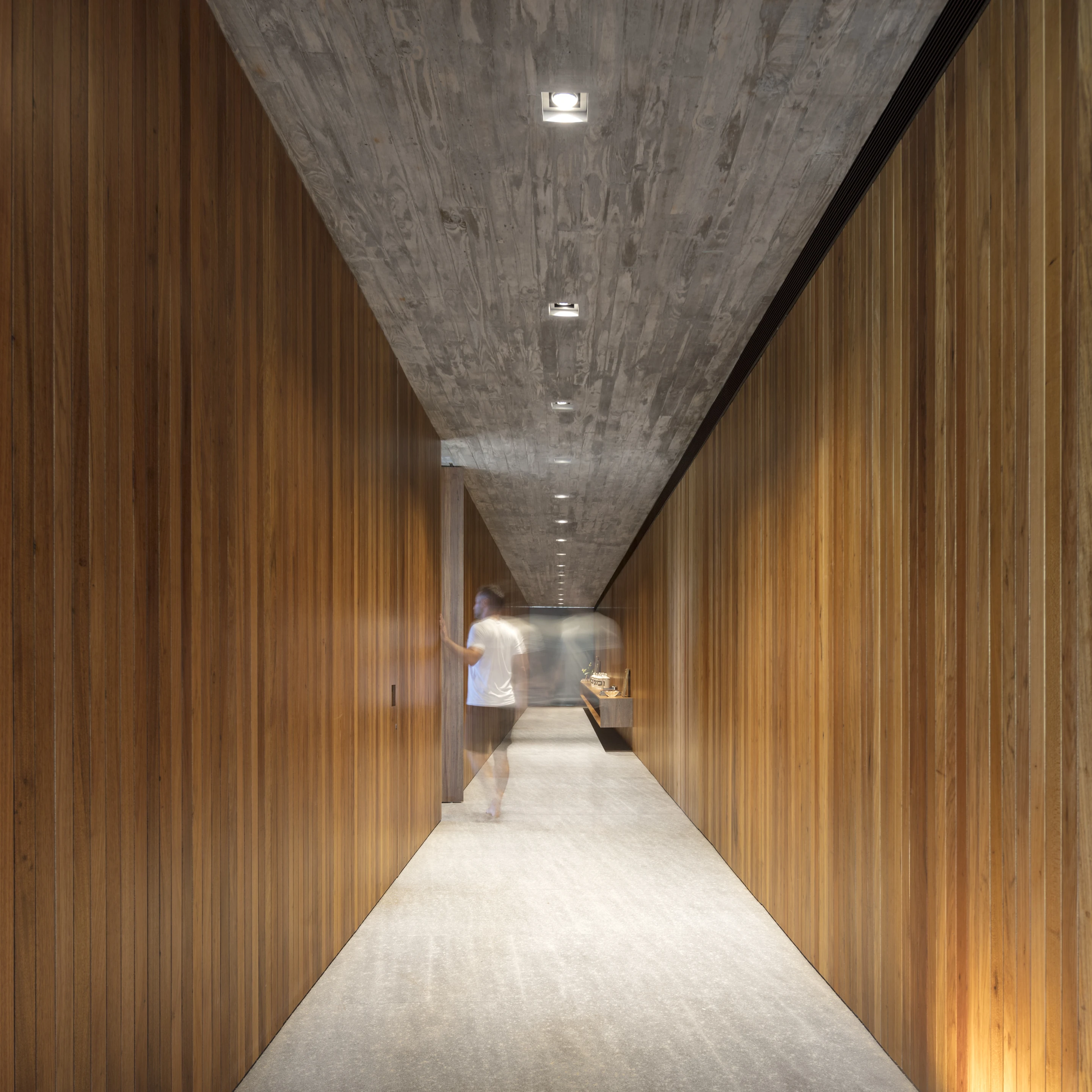 The interior decor of Planar House consists of a tasteful palette of wood, glass and concrete
