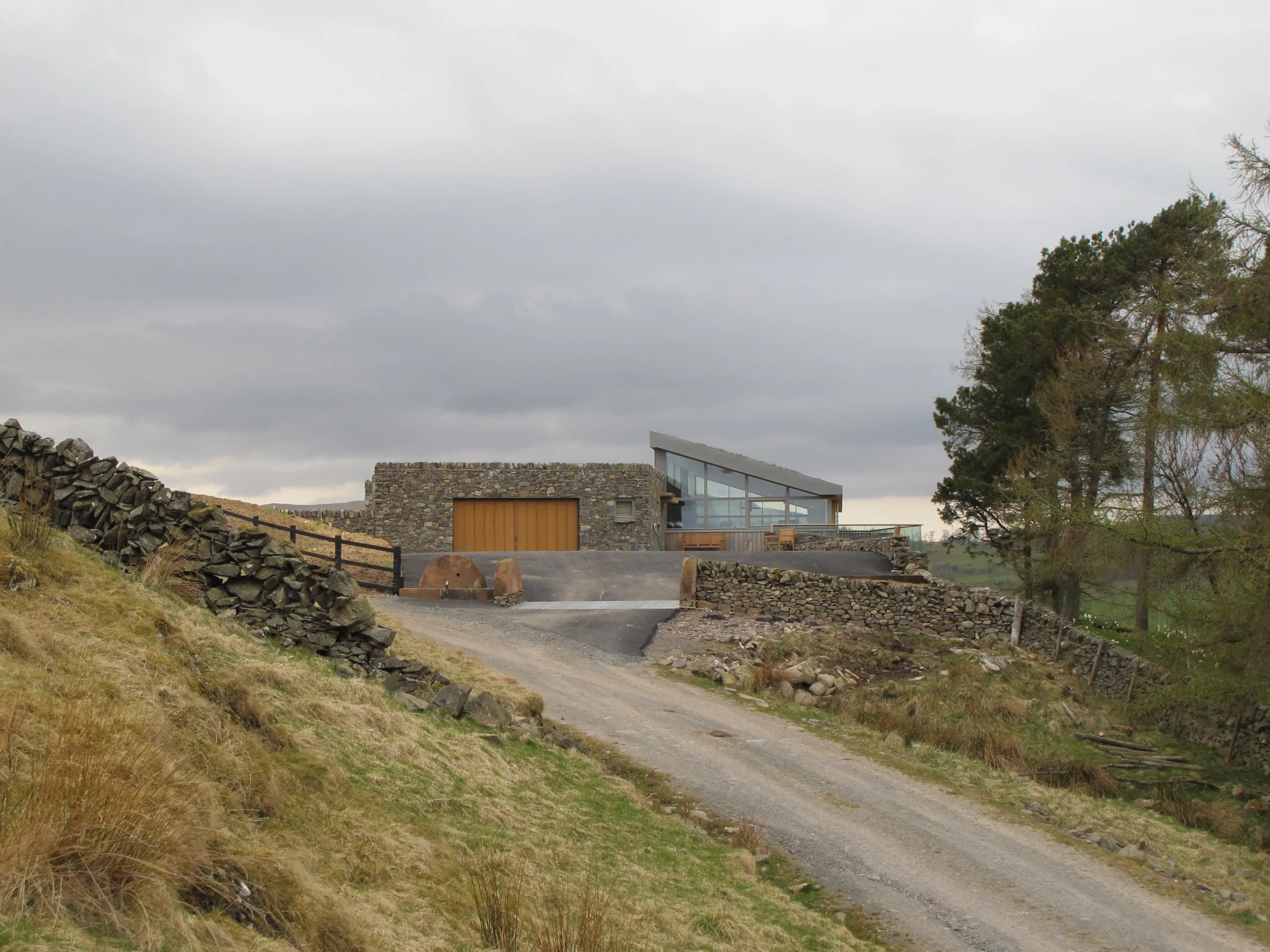 The building is clad with oak grown on the farm (Photo: Mark Waghorn Architects)
