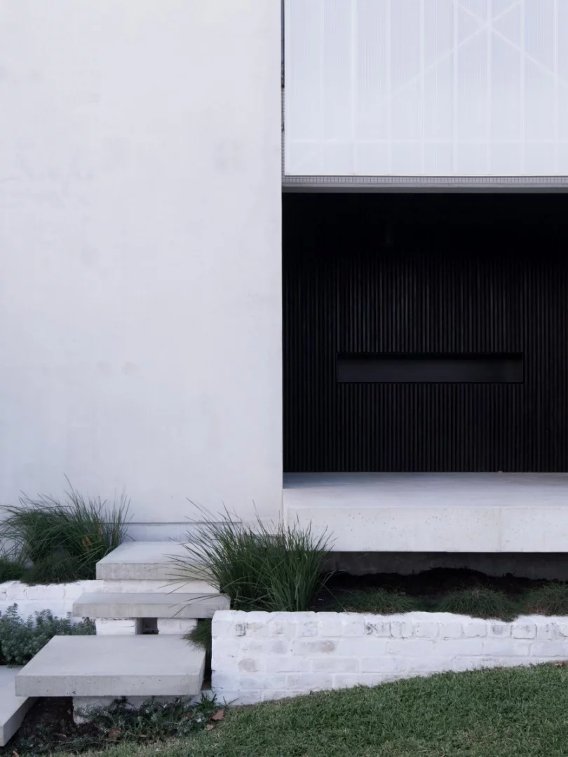 Simple landscaping leads to the home's entrance