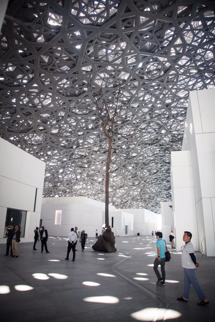 Visitors to the Louvre Abu Dhabi take in the surroundings