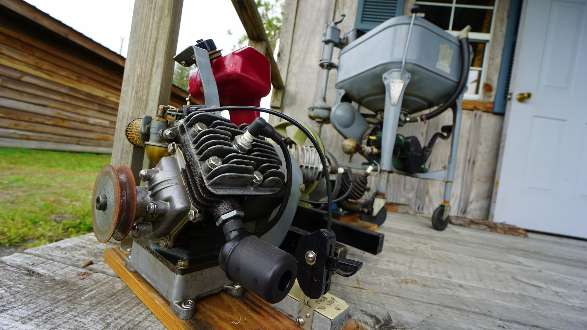 Vintage engines and an antique washing machine on display in the village