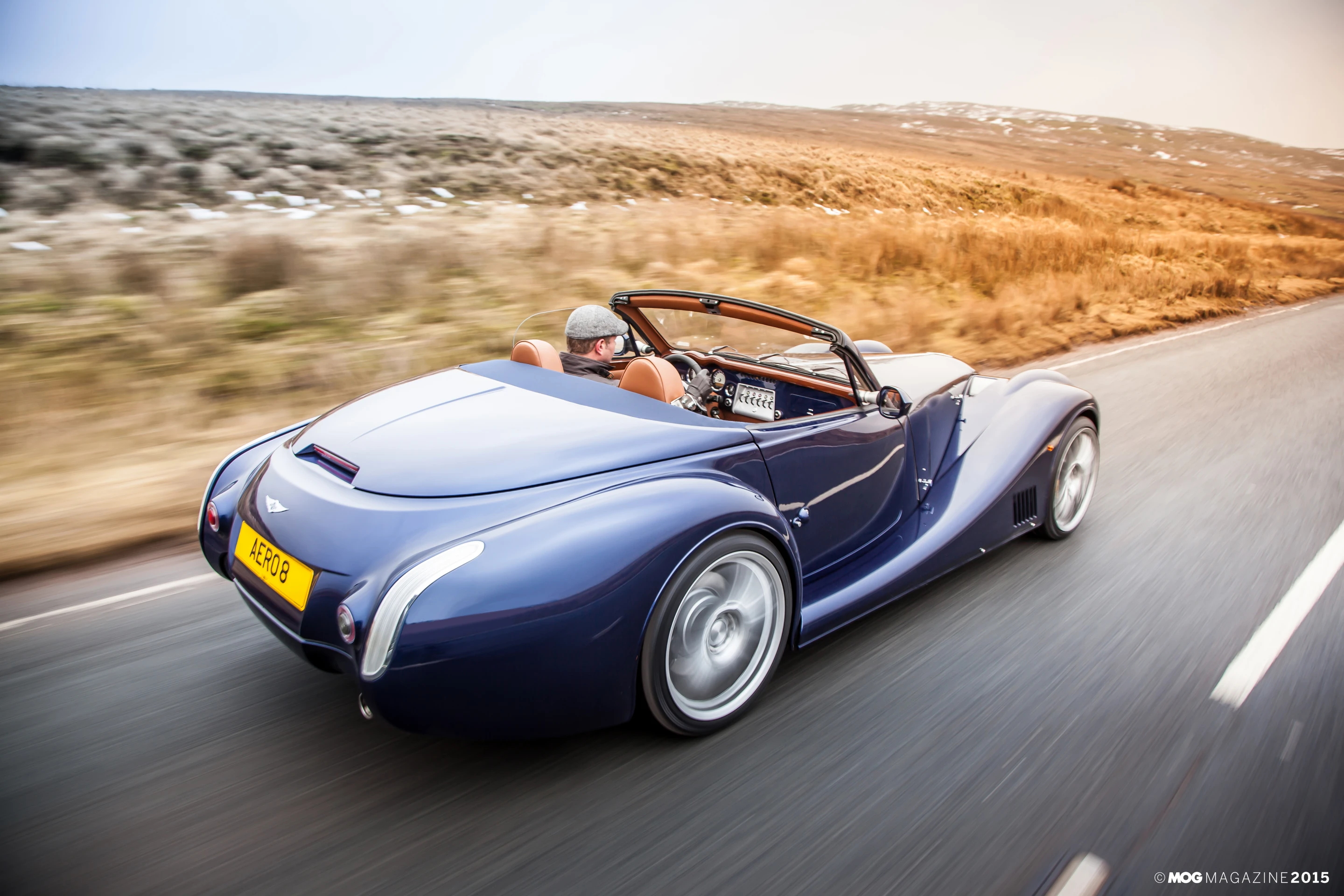Heading out for a drive in a Morgan Aero 8, top down, of course