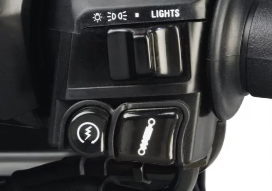 Electronic suspension adjustment button sits right next to the starter button.