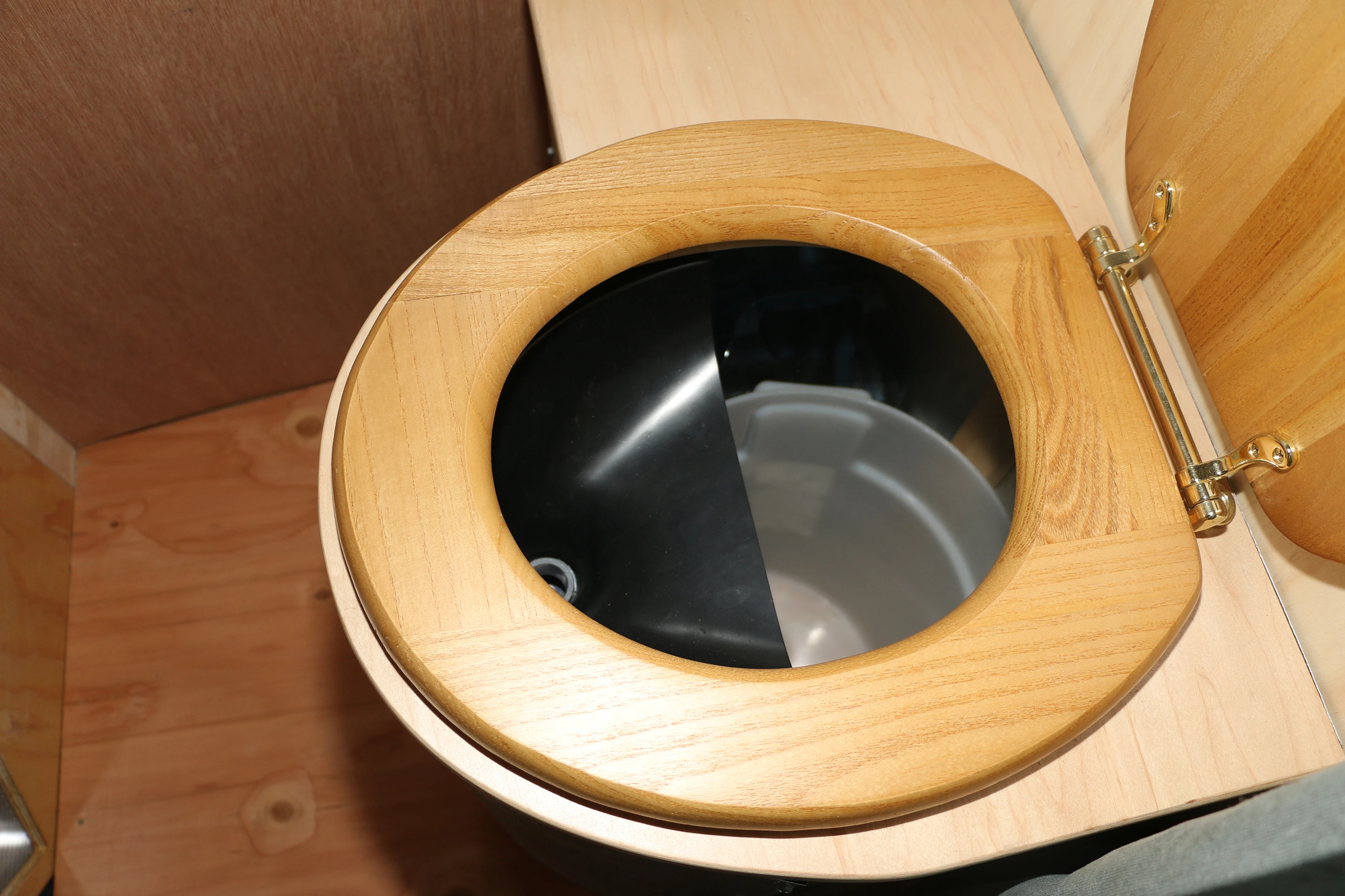 Inside, the snug home contains a composting toilet, rainwater collection system, and a rudimentary sink