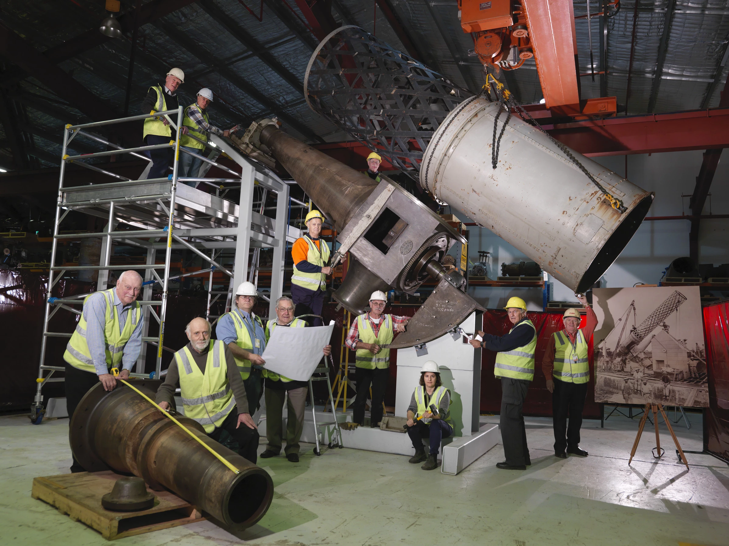 Volunteers and staff with components of the Great Melbourne Telescope at Moreland Annexe