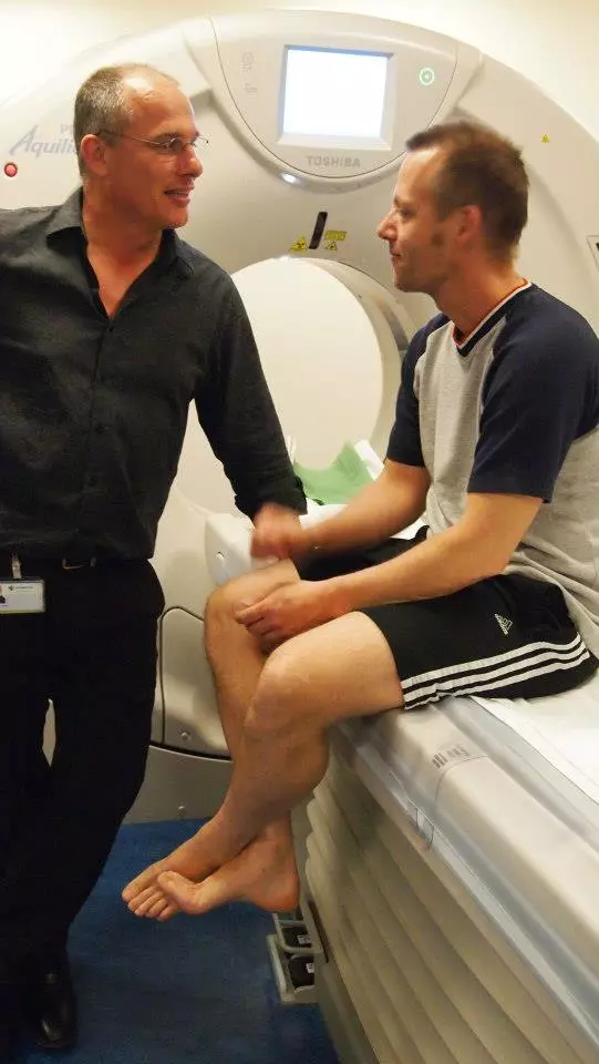 Caspar Berger sits in a CT scanner at Toshiba Medical Systems Europe