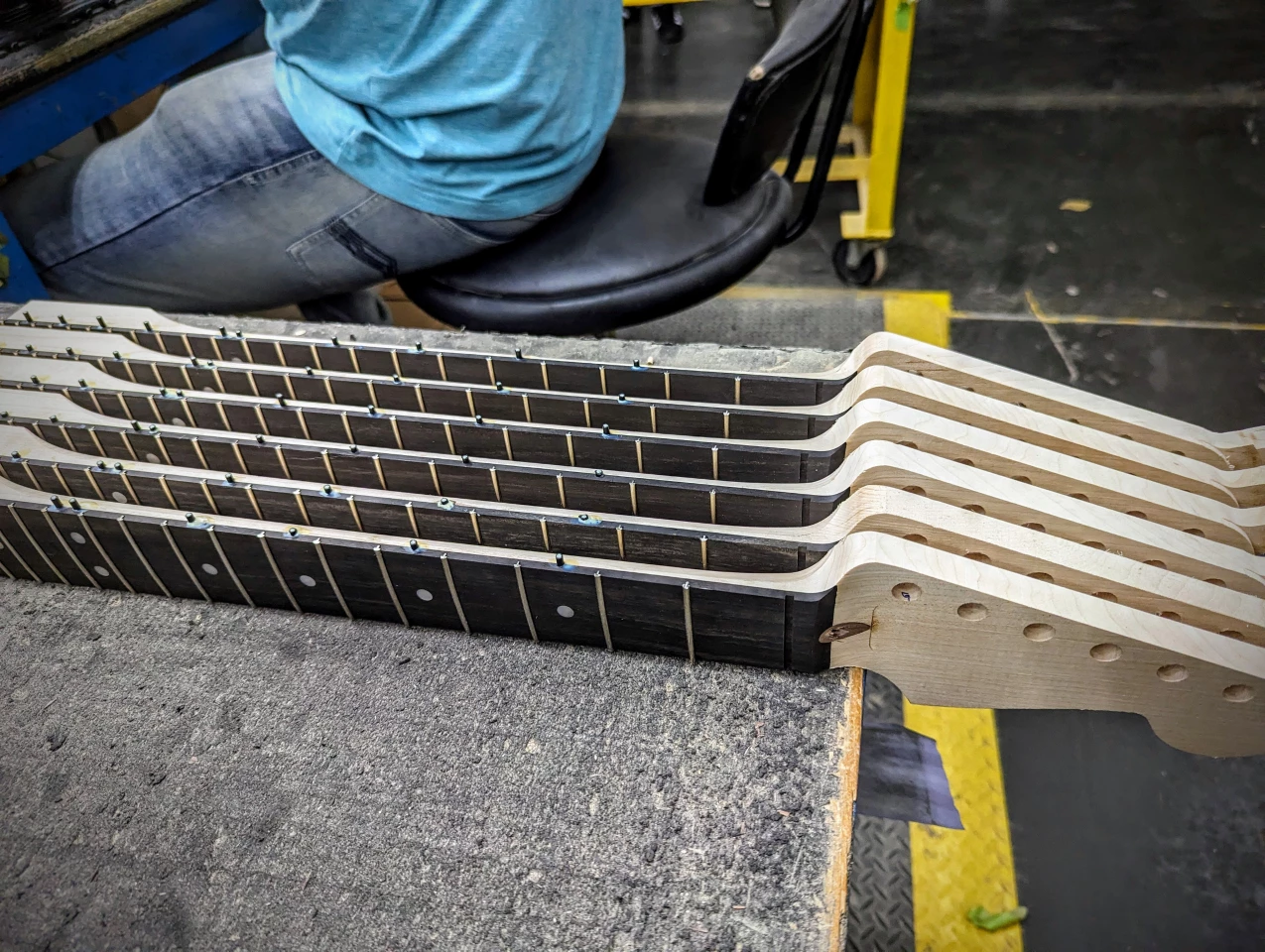 Rosewood Stratocaster necks in progress, with the fret markers still poking out
