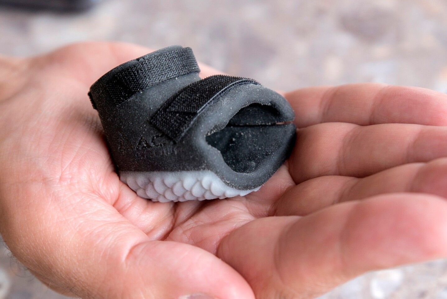 The printed boot is lighter, more durable, a better fit and has Purps walking and swimming as well as his penguin pals