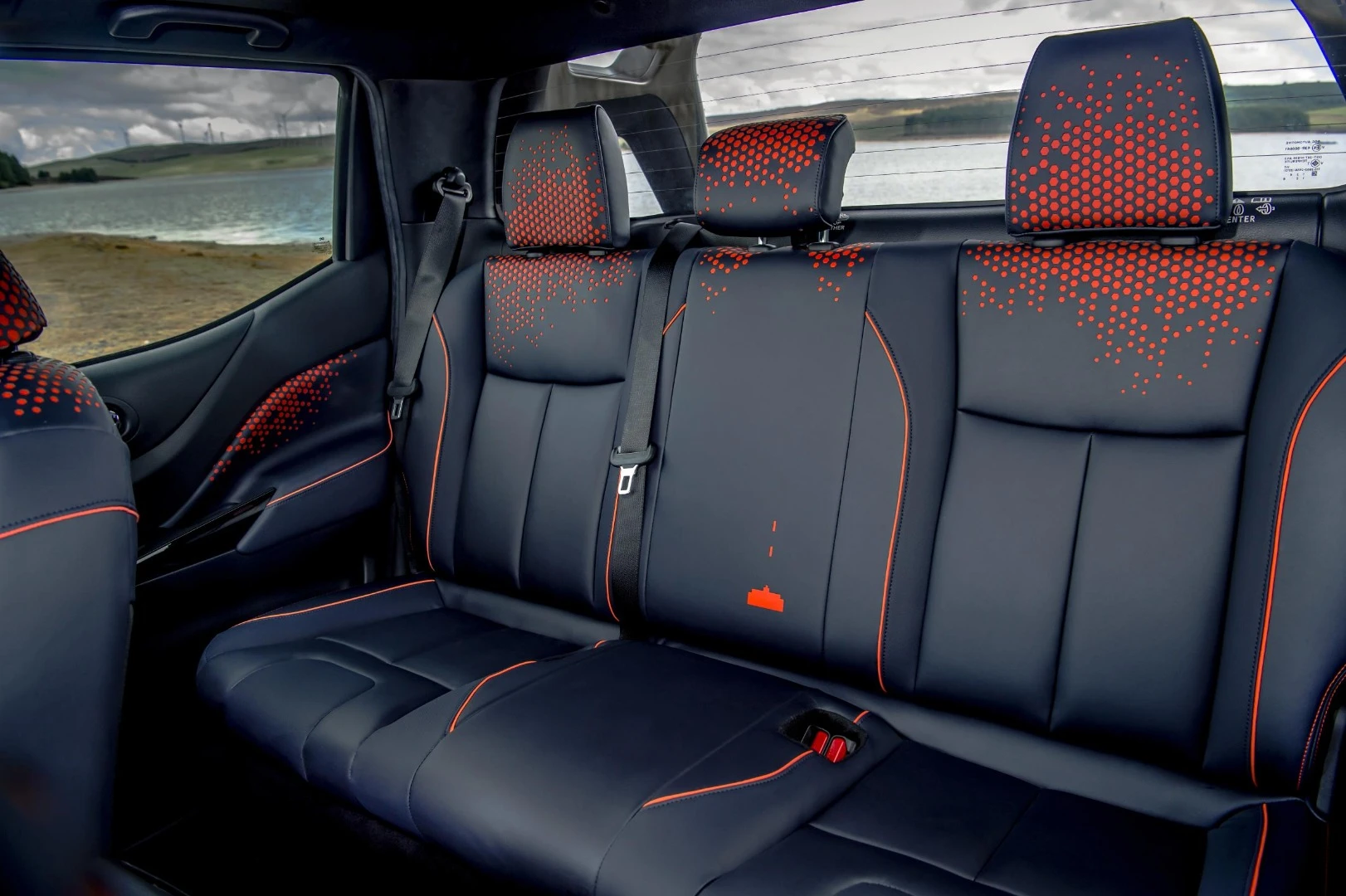 Inside, Nissan blends the dark sky look with some "setting sun" orange