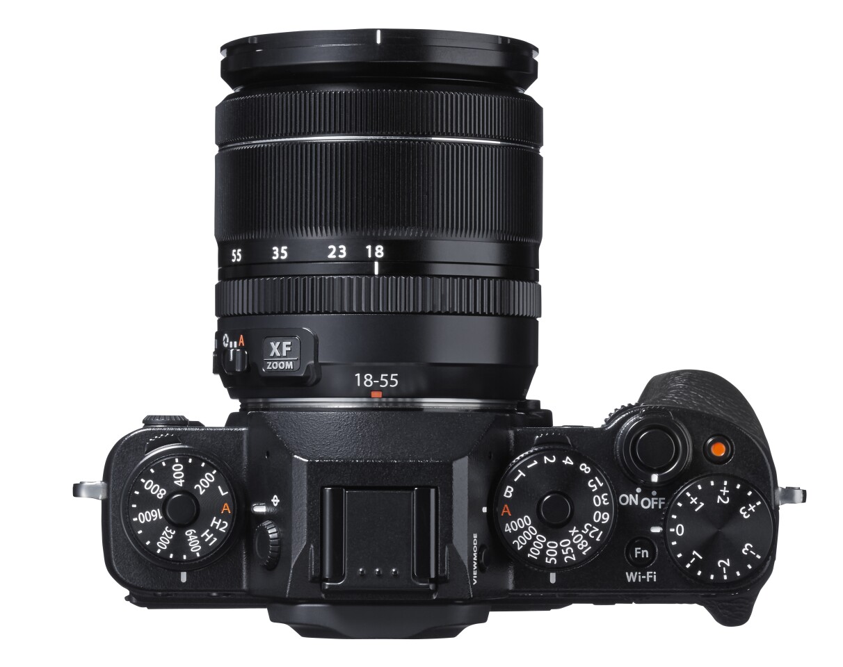 There are five mechanical dials to the top, including two machined aluminum double-deckers for controlling shutter speed/metering and ISO/drive, command dials to the front and back, and six customizable function buttons