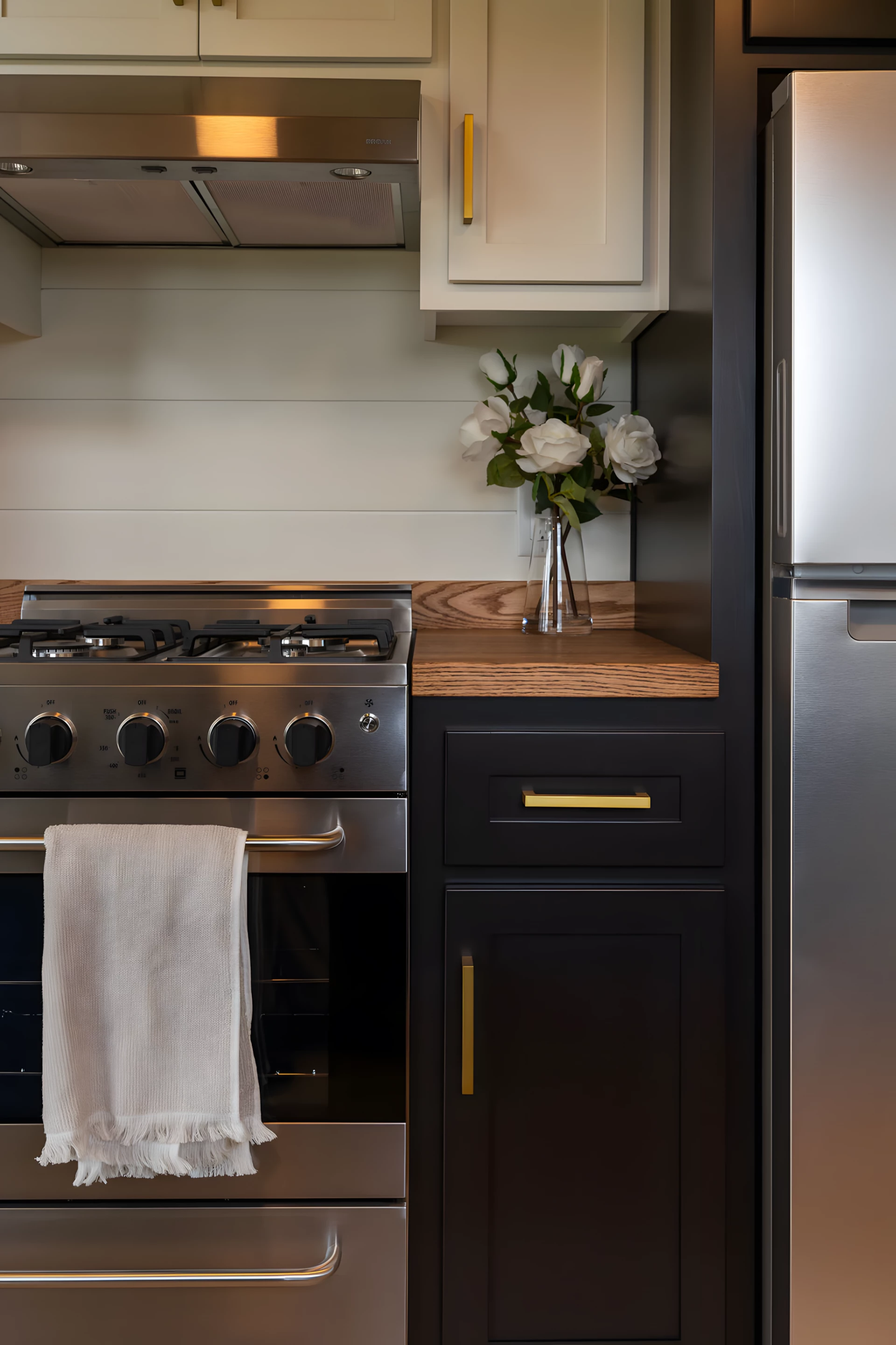 The Rutledge's kitchen is spacious and includes a four-burner propane-powered cooktop, an oven, a fridge, a sink, and hookups for a washer/dryer