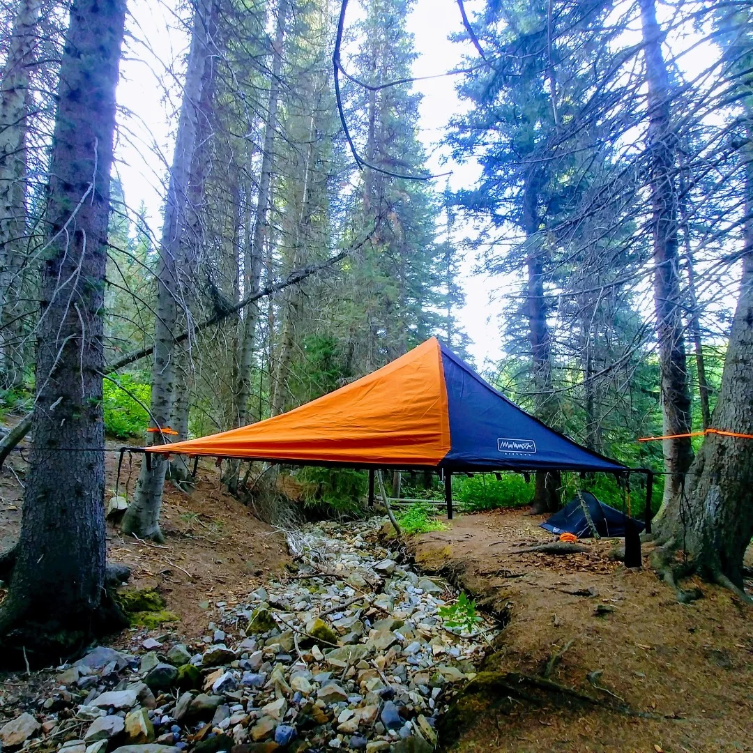 The Bivymok system can be suspended from trees to lift campers off the ground