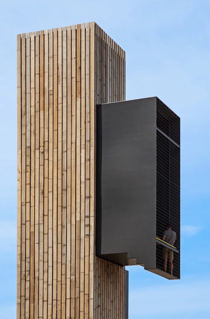 The lookout tower features a total of five containers, some clad in timber