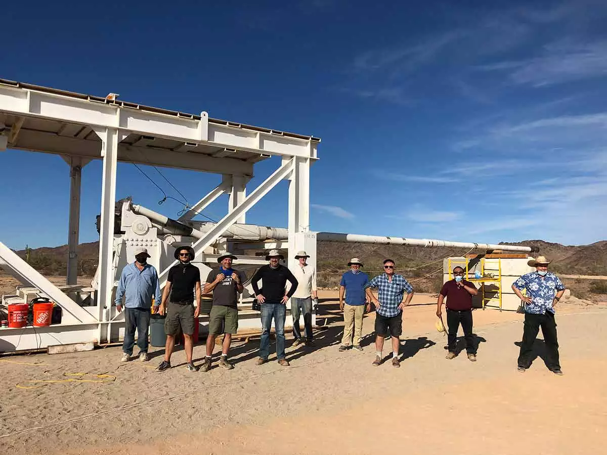 Members of the Green Launch team with the 54-foot proof of concept launch tube