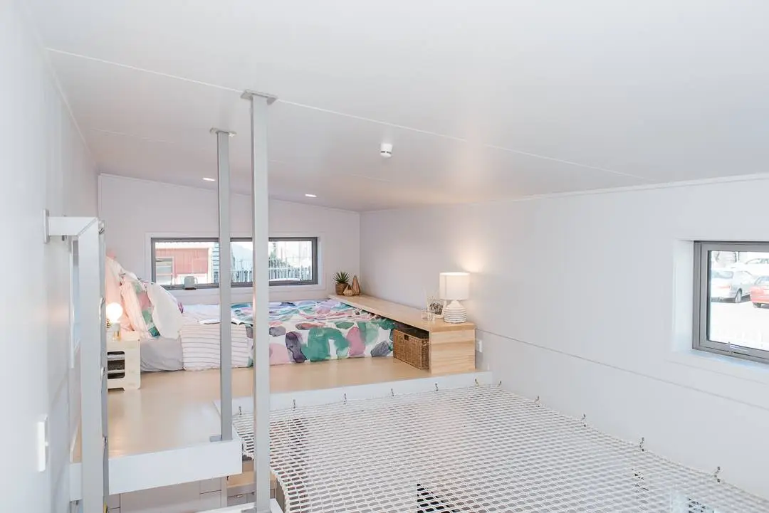 View towards the loft bedroom in the Larissa and Tyler Tiny House