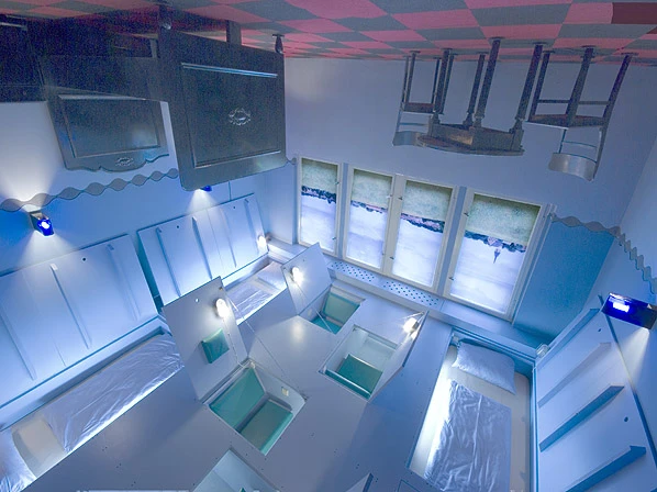 The Upside Down Room is equipped with furnishings that hang from the ceiling