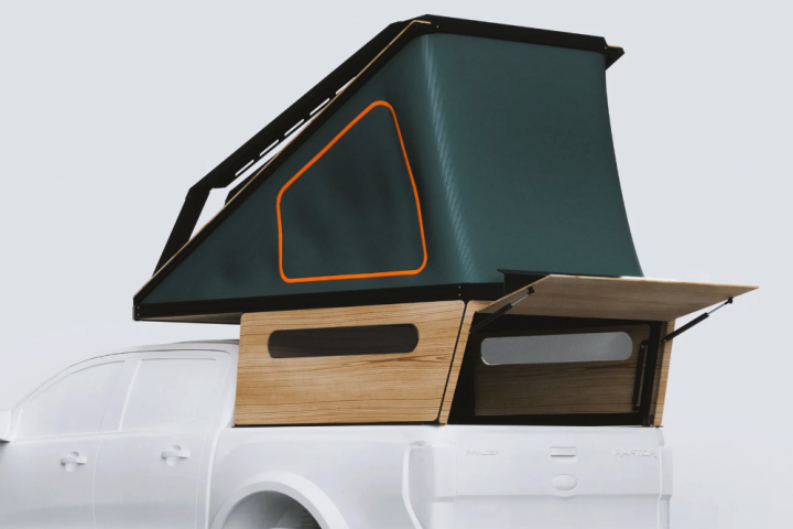 With colorful fabrics and available wood paneling, the DOT Alpaca looks quite different from the average pickup topper or camper