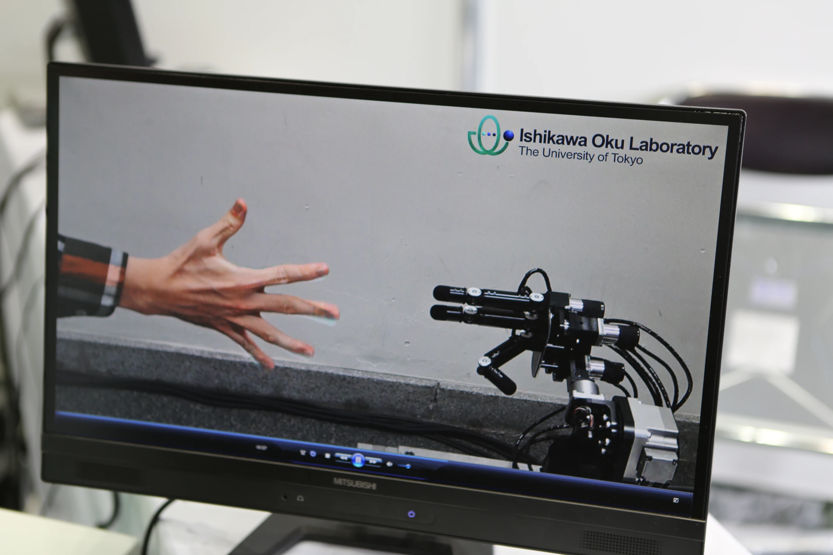 The robot sticks out two fingers for "scissors", beating the human's "paper" (Photo: Mike Hanlon, Gizmag)