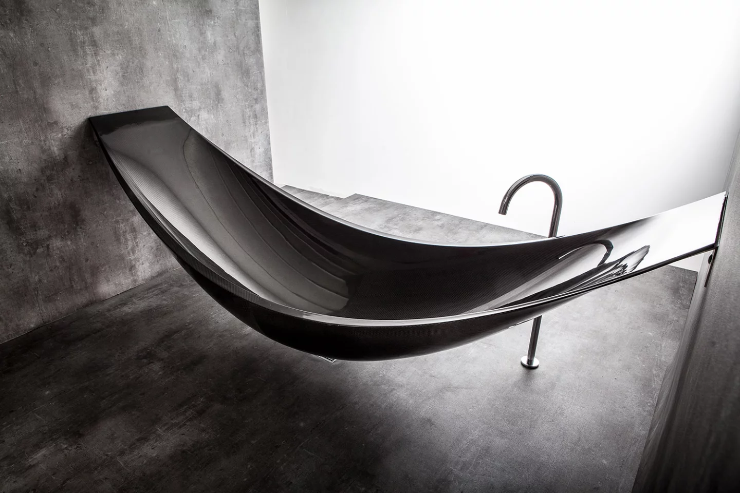 Design group Splinter Works' latest piece of furniture, the Vessel, is a sleek-looking bathtub suspended in the air like a hammock
