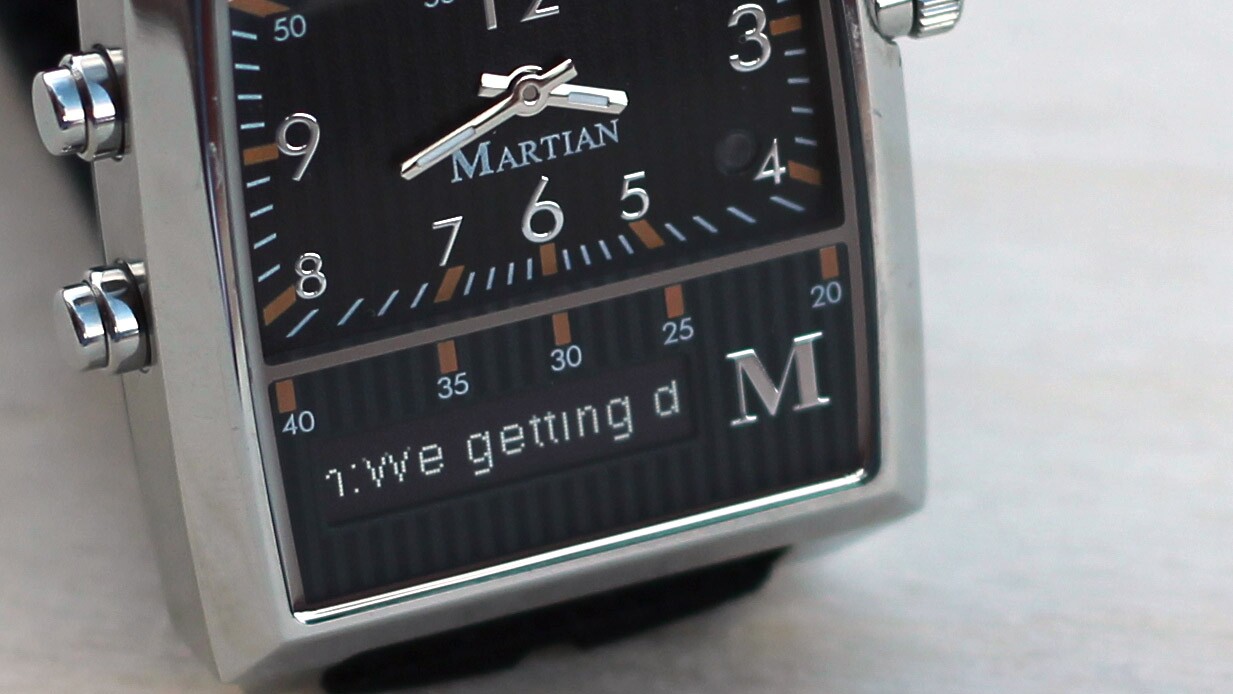 The notification also scrolls across the watch's horizontal screen