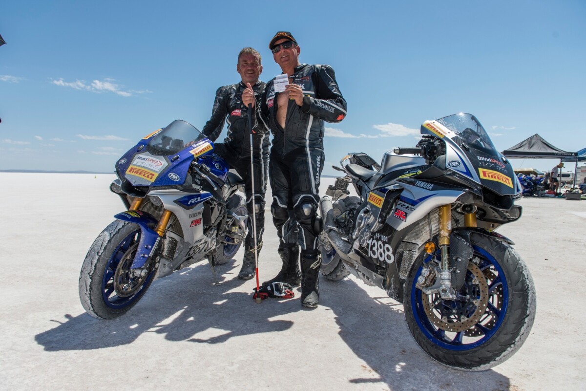 Blind land speed record holder Ben Felten celebrates with ex-MotoGP racer Kevin Magee after setting a blind motorcycle speed record last year. This year, on a new Kawasaki ZX-10, they hope to beat their 156.25 mph record from 2017