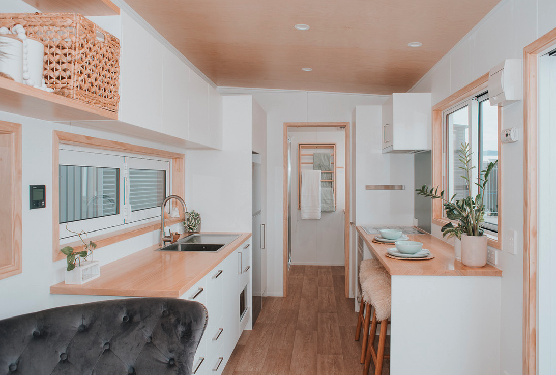 Kotsuku's interior features light hues, is finished with poplar core plywood, and has vinyl floors.
