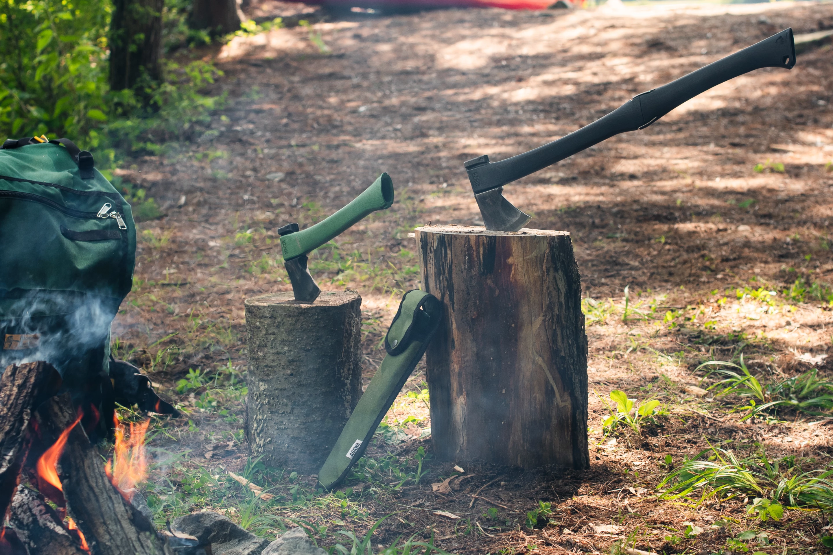 The ADK26 in both hatchet (left) and axe (right) modes, alongside the included carrying case