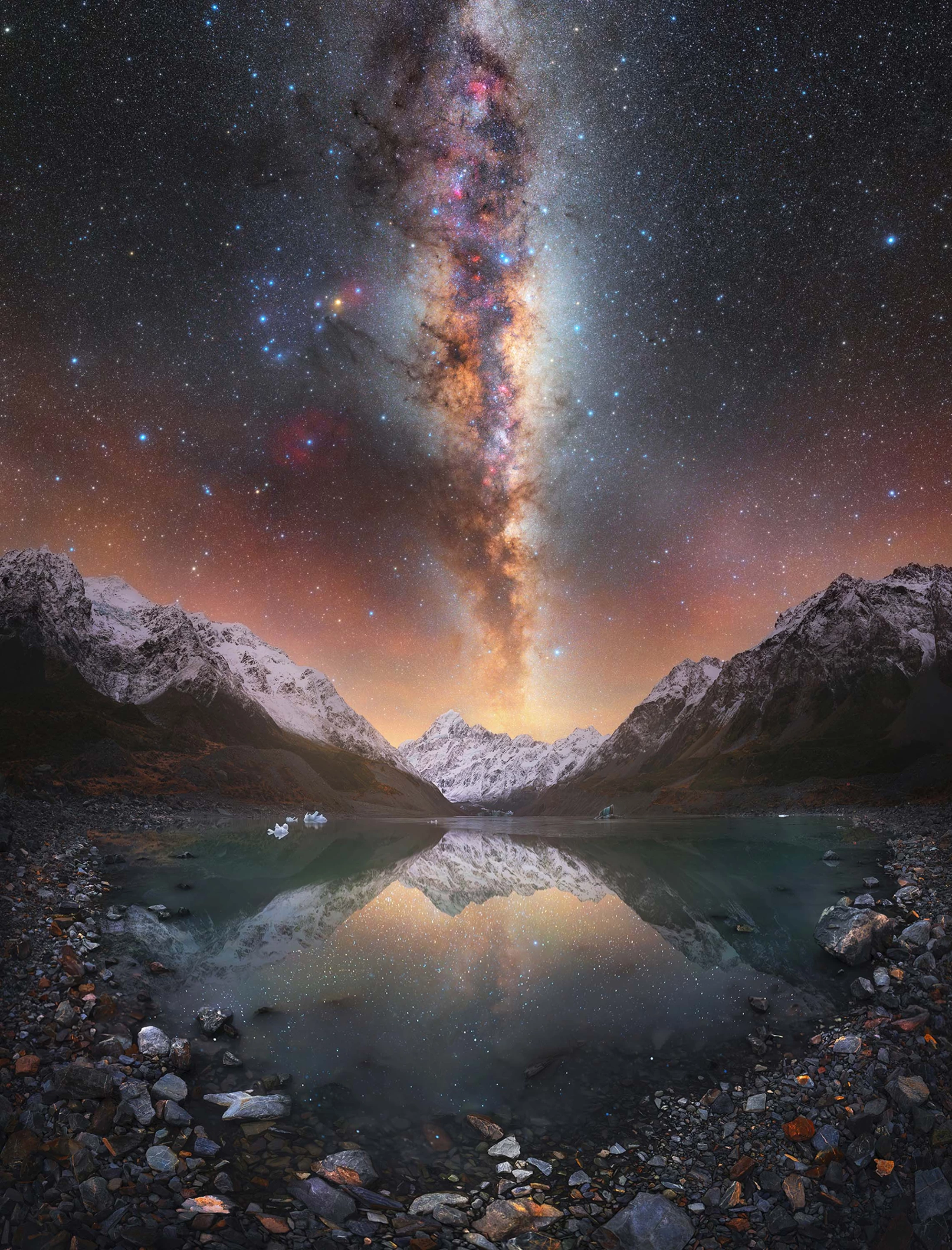 Lightning Lake by Tom Rae, taken in New Zealand. The Milky Way looms large above a glacial lake atop New Zealand's highest mountain, Aoraki.